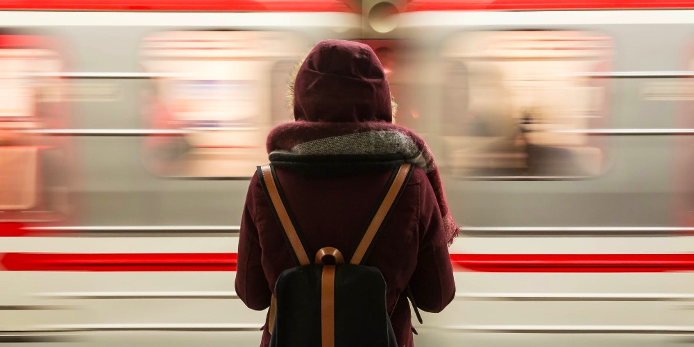 woman in front of passing train spiritual places in hungary